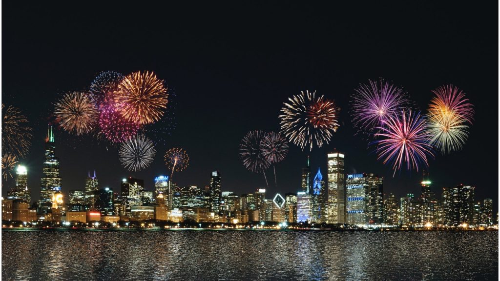 Colourful firework display over a cityscape