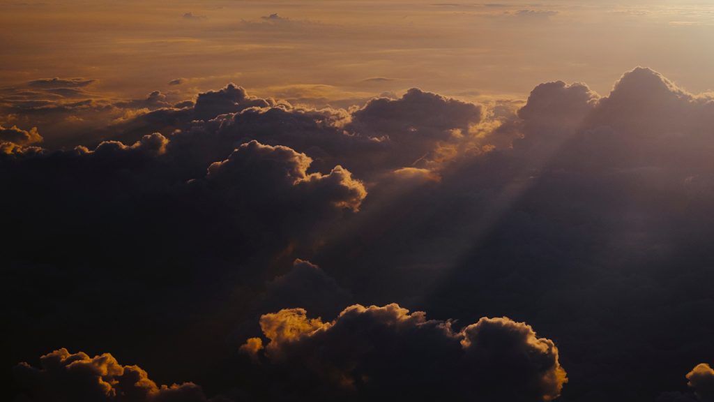 Dark clouds tinged with orange light