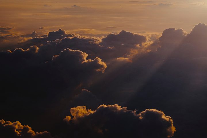 Dark clouds tinged with orange light