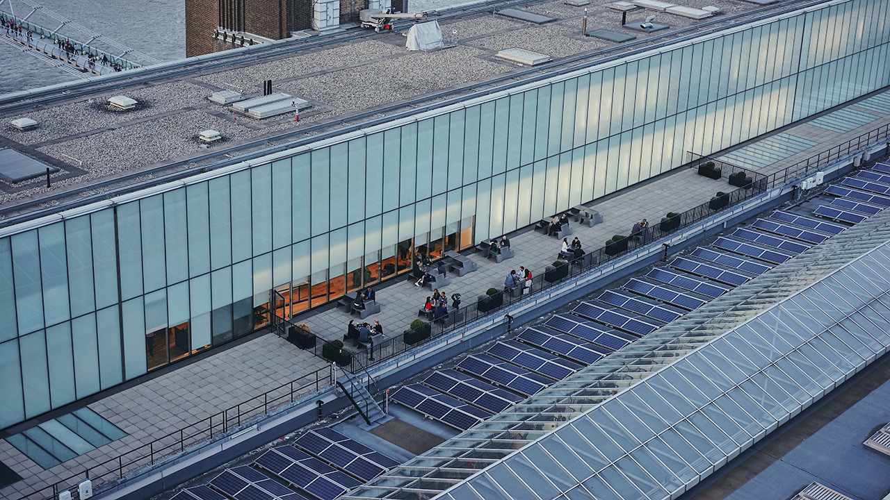 Solar panel line roof-top on Tate Modern building.