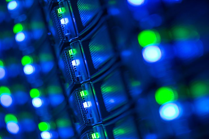 Small blue and green lights on part of a computer