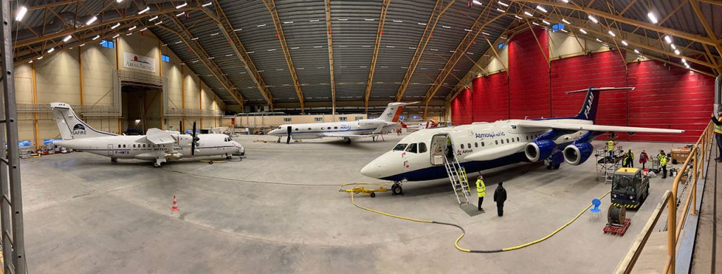 Three research aircraft inside a large hangar