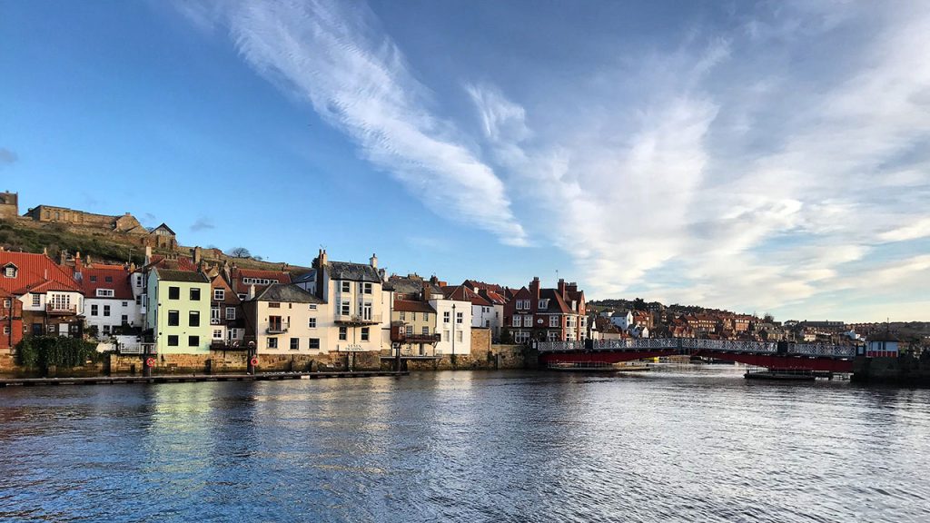 Row of houses along Whitby coastline