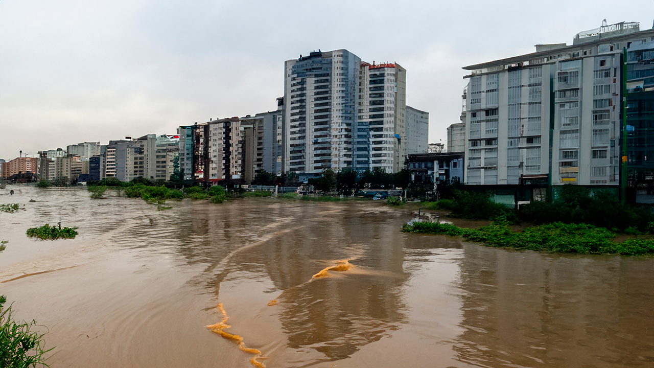 Flood waters surrounding blocks of flats.