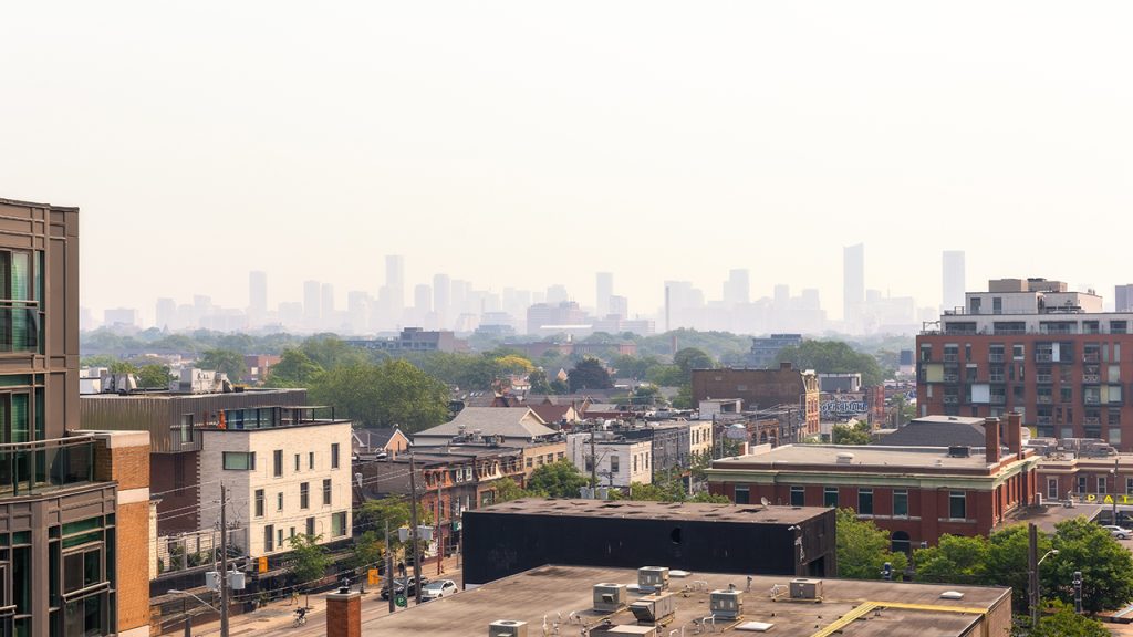 City skyline hazy with smoke from wildfires.