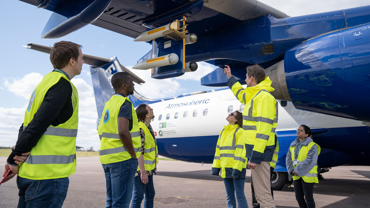 Colleagues from the FAAM Airborne Laboratory look at the aircraft.