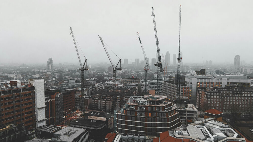 Foggy day in central London, with construction cranes and high rise buildings