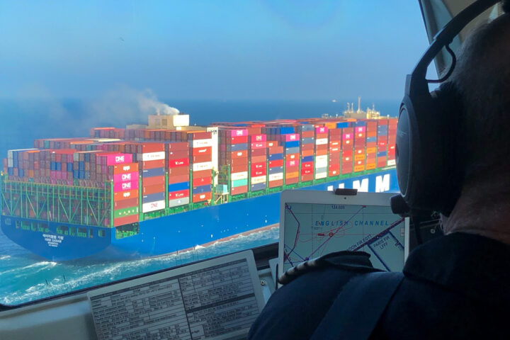 View of a cargo ship from an aircraft cockpit