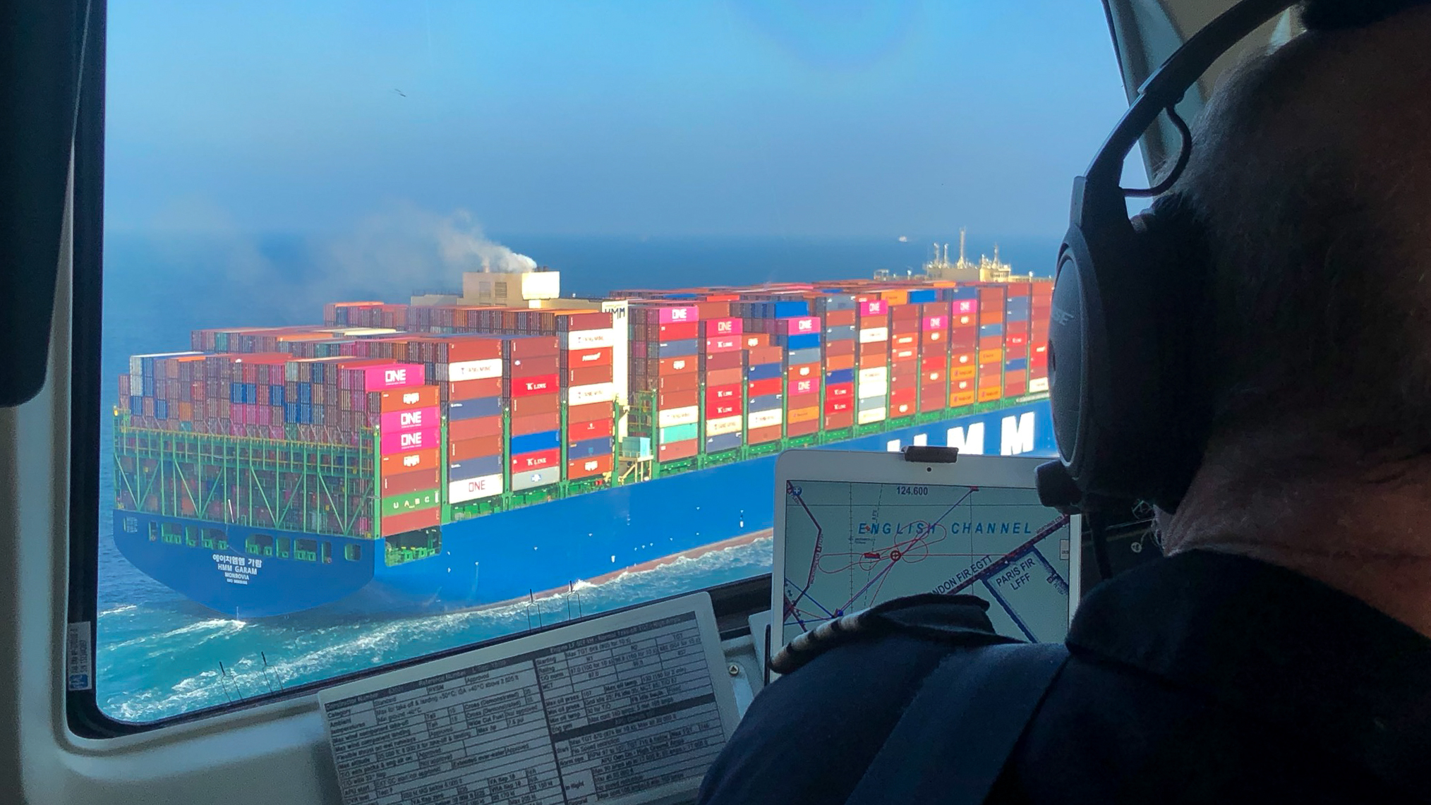 View of a cargo ship from an aircraft cockpit