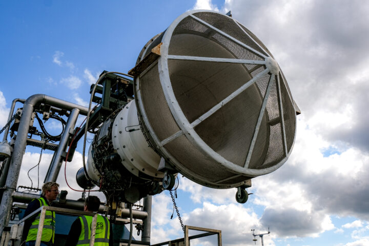 Aircraft engine mounted on a metal structure at an emissions testing facility