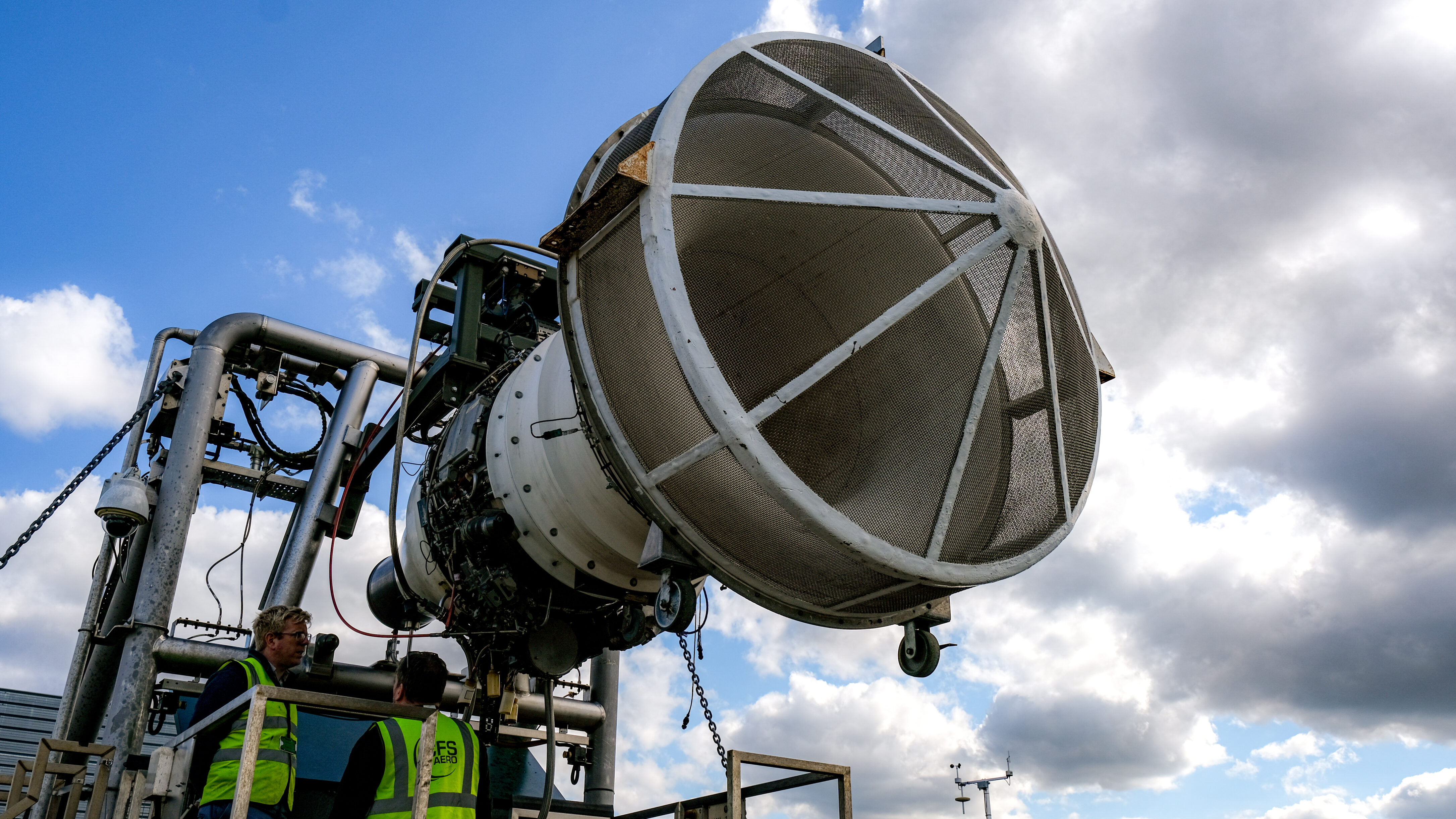 Aircraft engine mounted on a metal structure at an emissions testing facility