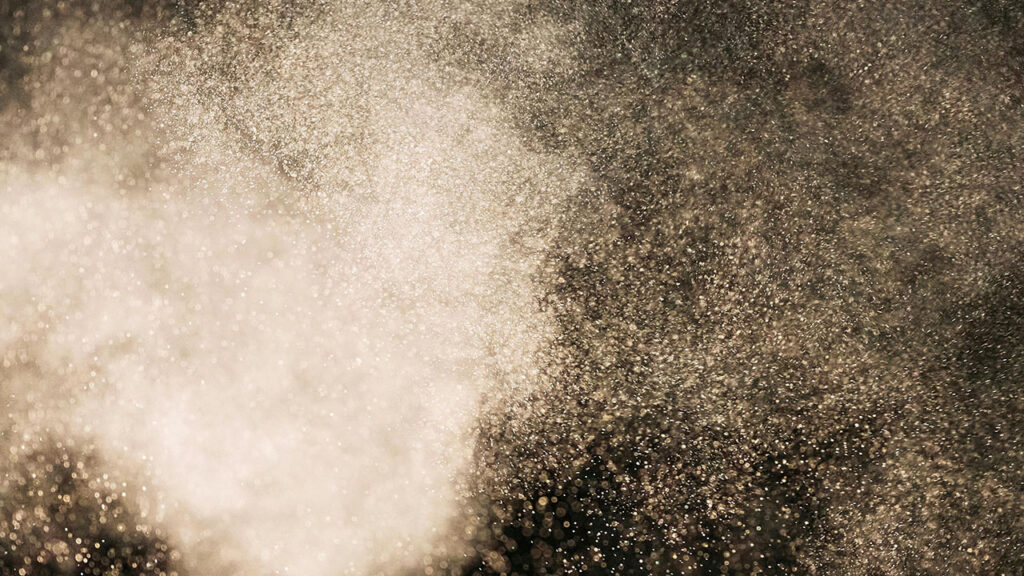 Dust particles spreading through the air