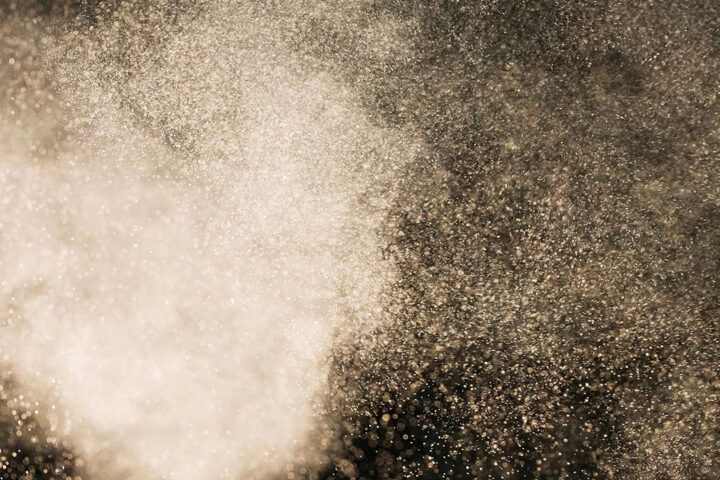 Dust particles spreading through the air