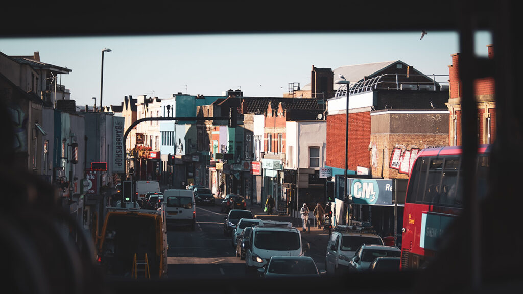 View from inside a bus towards a busy street.