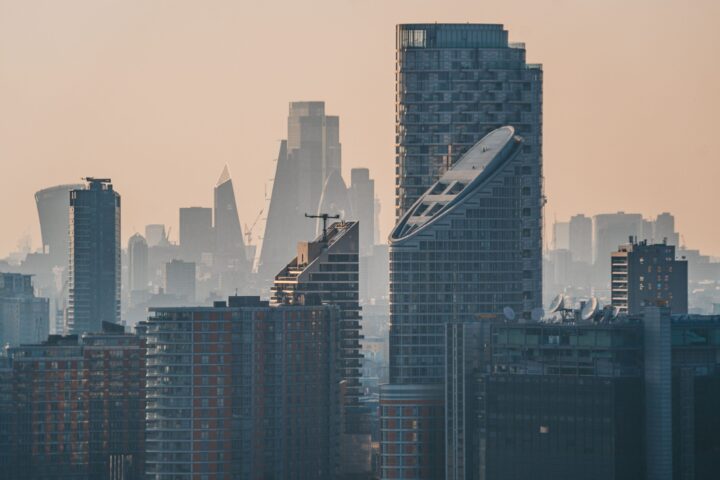 Urban landscape with tall skyscrapers in smog