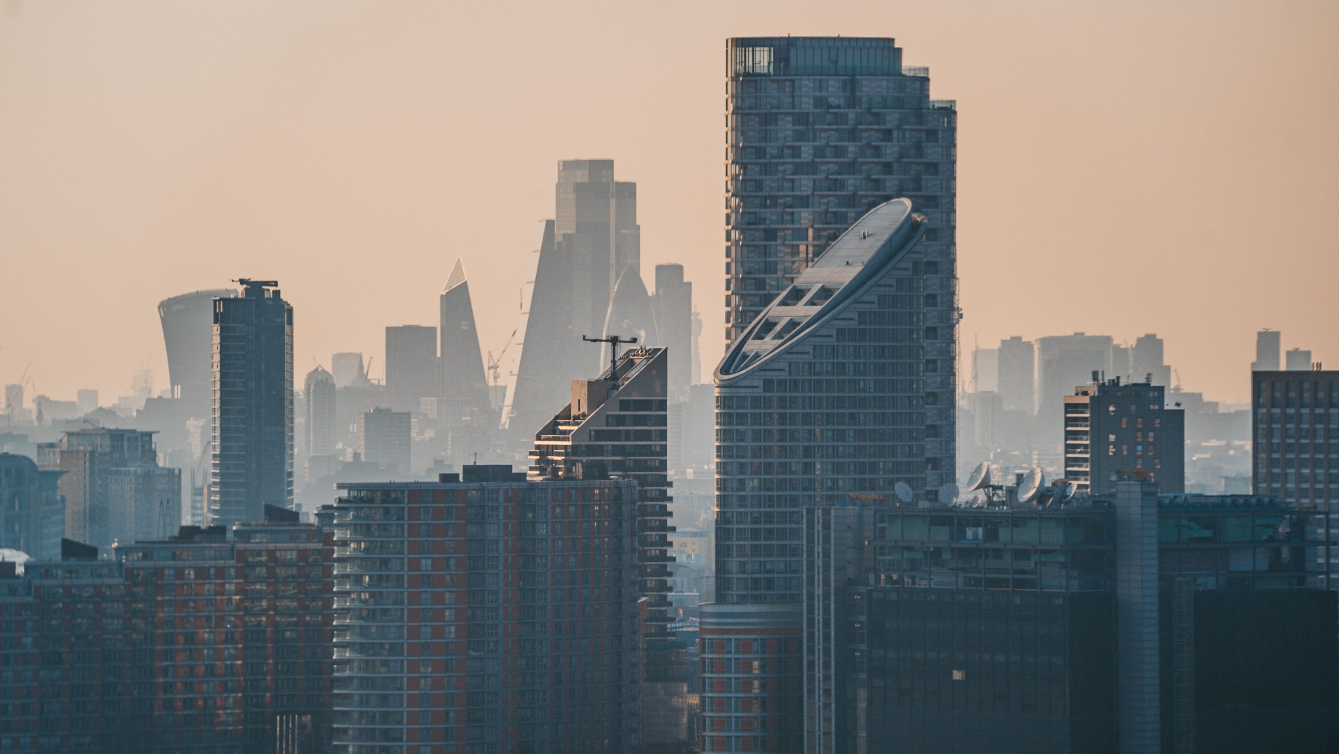 Urban landscape with tall skyscrapers in smog
