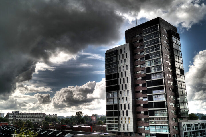Storm clouds above a high rise tower of flats.